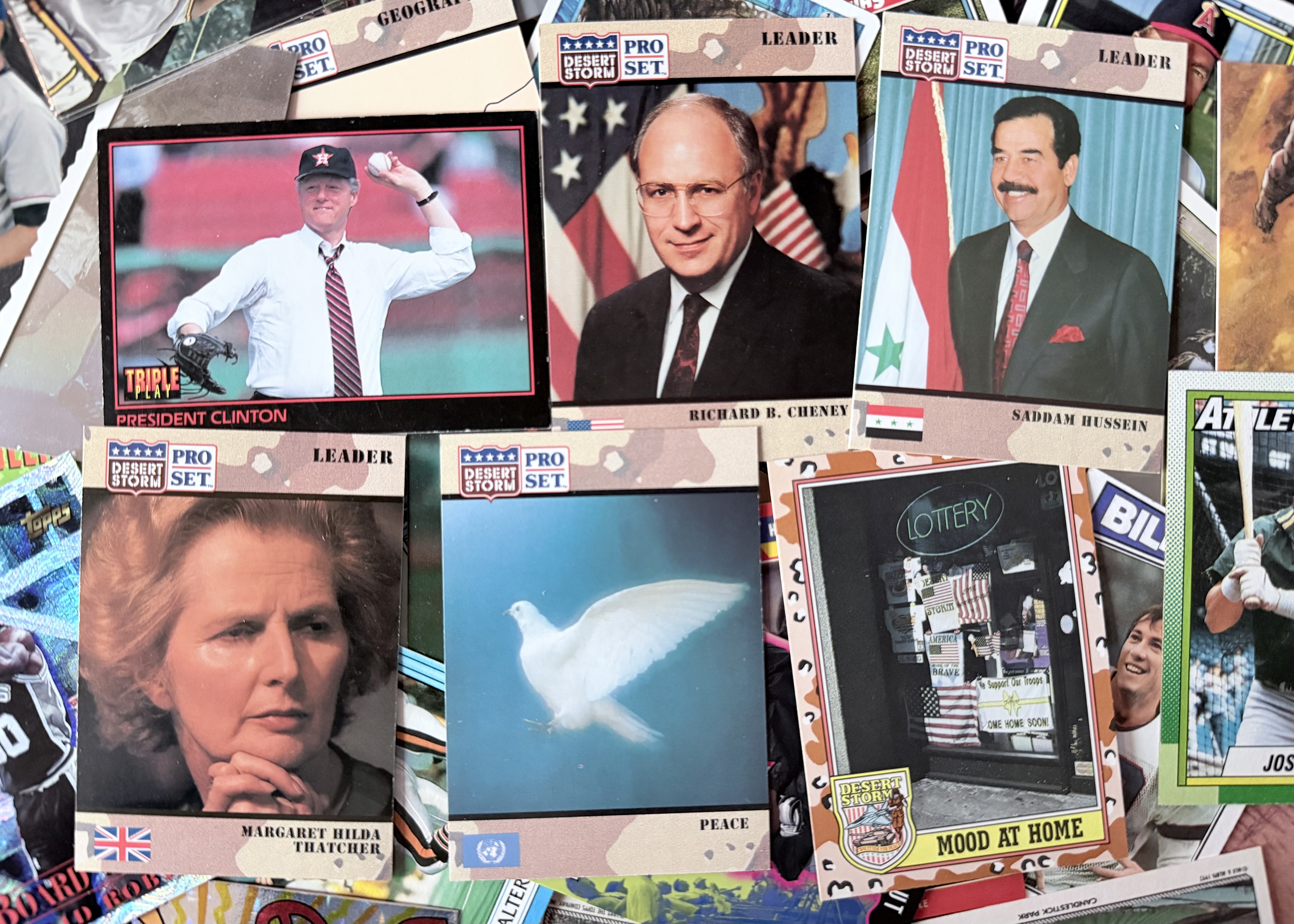 A collection of Desert Storm trading cards and one of Bill Clinton pitching