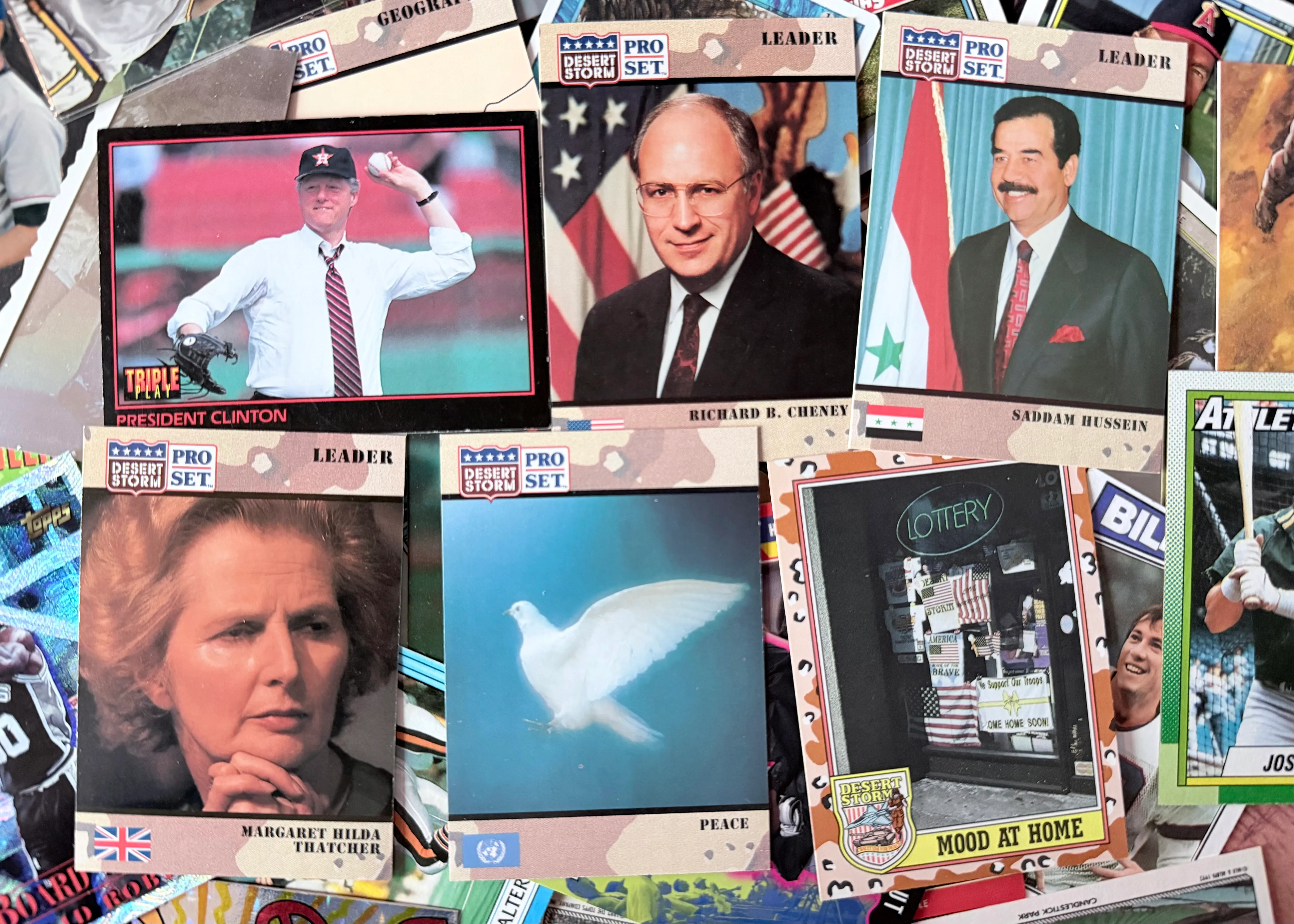 A collection of Desert Storm trading cards and one of Bill Clinton pitching